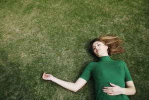 body scan woman laying in grass copy