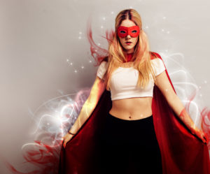 Portrait of a young woman dressed as superhero